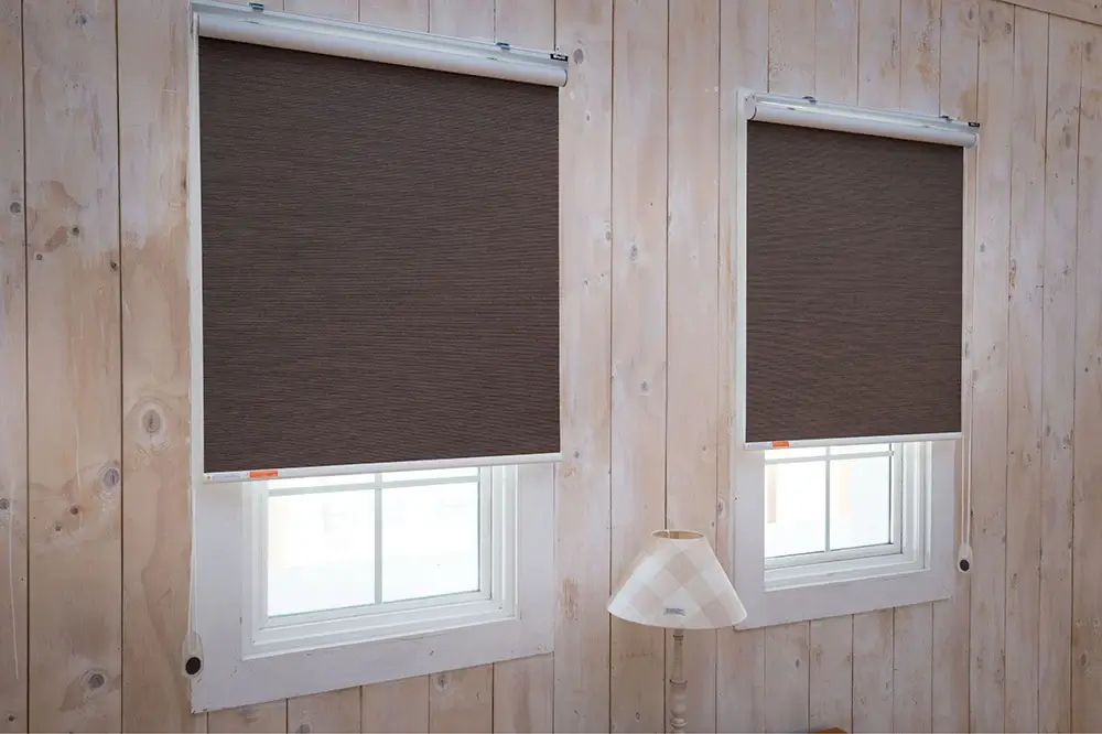 Roller blinds in two windows
